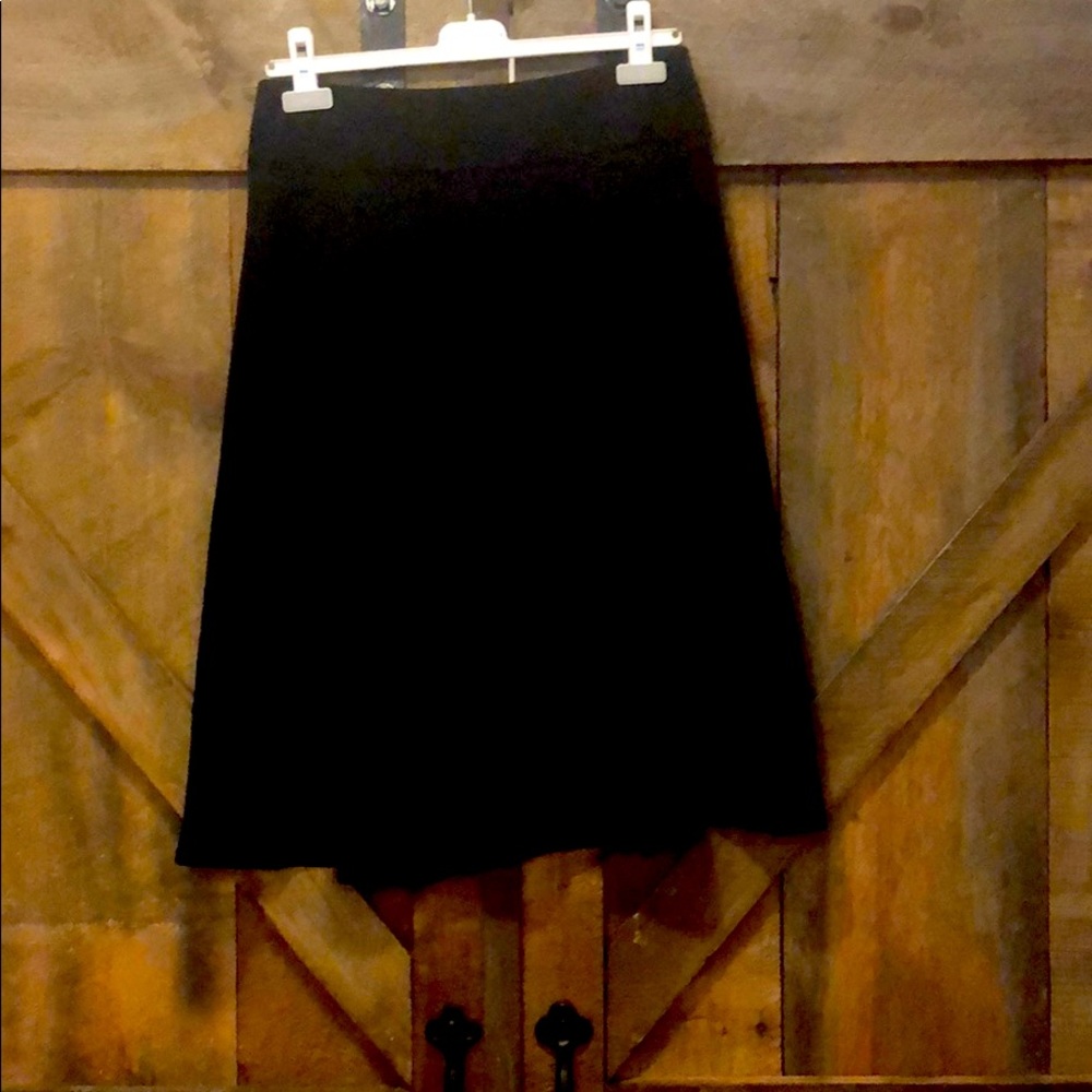 Full black skirt with border.